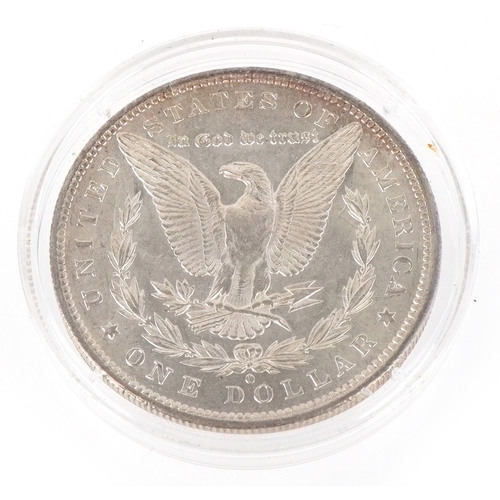 1086 - An 1884 USA Morgan silver dollar, New Orleans Mint mark, extremely fine condition to uncirculated.