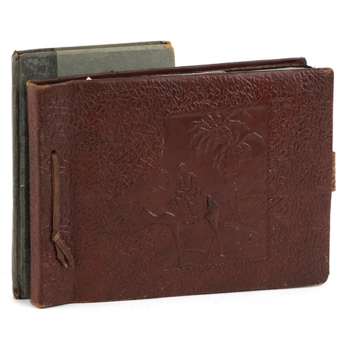 1297 - Two albums of 20th century black and white photographs, one album predominantly Suez views and shipp... 