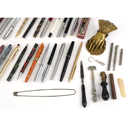 66 - Vintage and later fountain pens and ballpoint pens including Cross, Osmiroid and Conway Stewart.