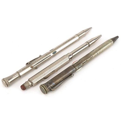 76 - Three vintage silver plated combination pens, the largest 14cm in length.