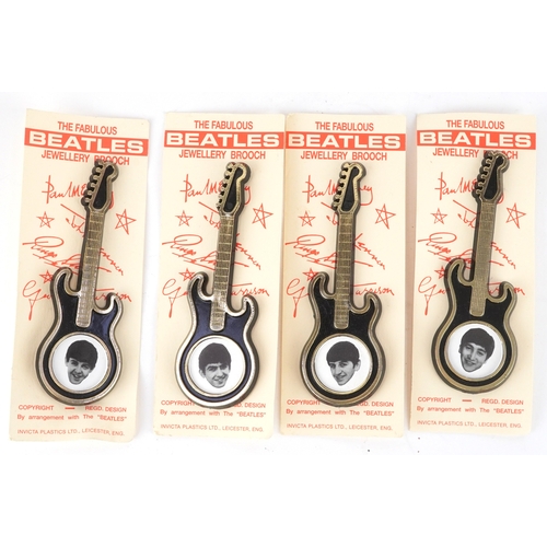 2635 - The Beatles, five novelty guitar brooches, 10.5cm in length.