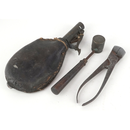 2827 - An antique leather powder flask, a bullet/shot mould and shot measure, the largest 17cm in length.