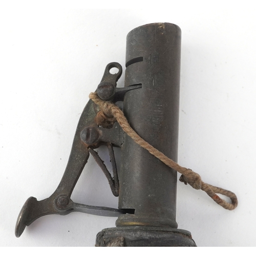 2827 - An antique leather powder flask, a bullet/shot mould and shot measure, the largest 17cm in length.