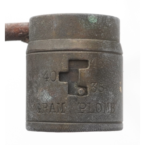 2827 - An antique leather powder flask, a bullet/shot mould and shot measure, the largest 17cm in length.