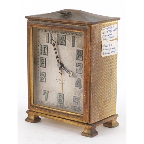 24 - Zenith, An Art Deco brass cased Zenith eight day alarm clock with leather travel case, the clock 9cm... 