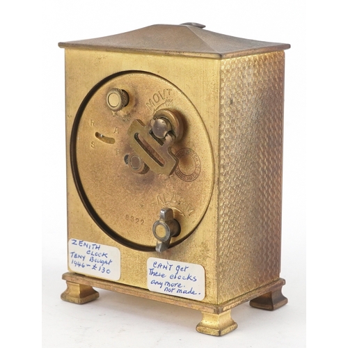 24 - Zenith, An Art Deco brass cased Zenith eight day alarm clock with leather travel case, the clock 9cm... 