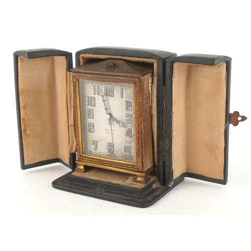 24 - Zenith, An Art Deco brass cased Zenith eight day alarm clock with leather travel case, the clock 9cm... 