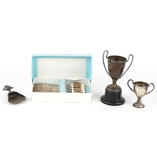 3641 - Antique and later silver comprising two twin handled trophies, a Dutch caddy spoon and set of 830 gr... 