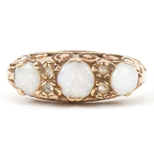 3065 - An unmarked gold graduated opal and clear stone ring with ornate setting, incomplete hallmarks, size... 