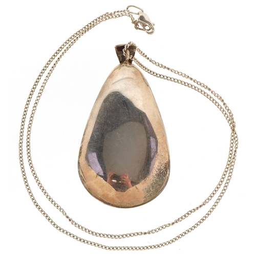 3196 - An unmarked silver amethyst pendant on a silver necklace, 5.9cm high and 50cm in length, total 38.4g... 