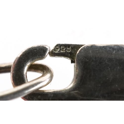 3196 - An unmarked silver amethyst pendant on a silver necklace, 5.9cm high and 50cm in length, total 38.4g... 