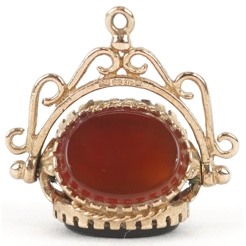 3228 - A 9ct gold carnelian, bloodstone and onyx spinner fob, 1.8cm high together with an unmarked gold dia... 