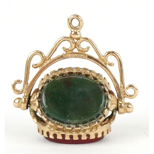 3228 - A 9ct gold carnelian, bloodstone and onyx spinner fob, 1.8cm high together with an unmarked gold dia... 