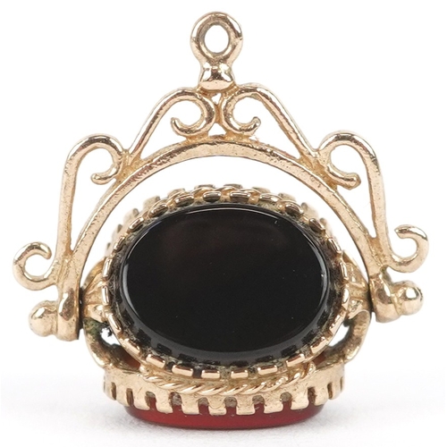 3228 - A 9ct gold carnelian, bloodstone and onyx spinner fob, 1.8cm high together with an unmarked gold dia... 