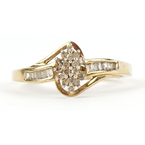 3192 - A 9ct gold diamond cluster ring with diamond set shoulders, size R, 2.6g.