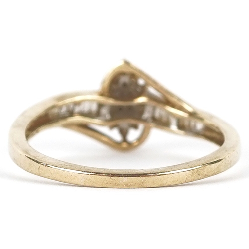 3192 - A 9ct gold diamond cluster ring with diamond set shoulders, size R, 2.6g.