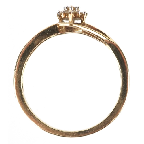 3192 - A 9ct gold diamond cluster ring with diamond set shoulders, size R, 2.6g.