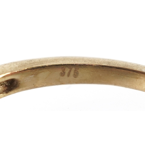 3192 - A 9ct gold diamond cluster ring with diamond set shoulders, size R, 2.6g.