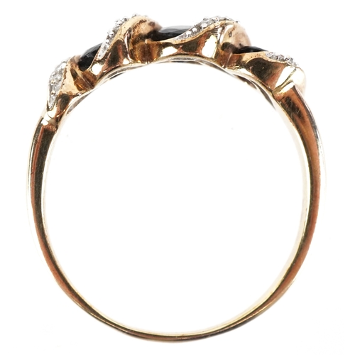 3229 - An 9ct gold sapphire and diamond crossover ring, size R, 3.0g.