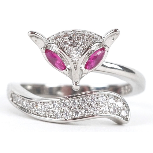 3234 - A silver ring in the form of a fox set with clear stones and ruby eyes, size L/M, 3.0g.