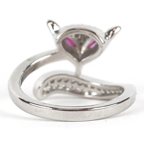 3234 - A silver ring in the form of a fox set with clear stones and ruby eyes, size L/M, 3.0g.