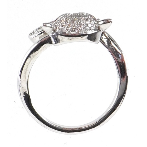 3234 - A silver ring in the form of a fox set with clear stones and ruby eyes, size L/M, 3.0g.