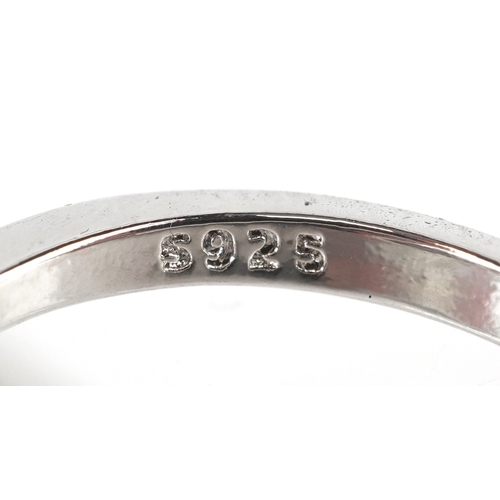 3234 - A silver ring in the form of a fox set with clear stones and ruby eyes, size L/M, 3.0g.