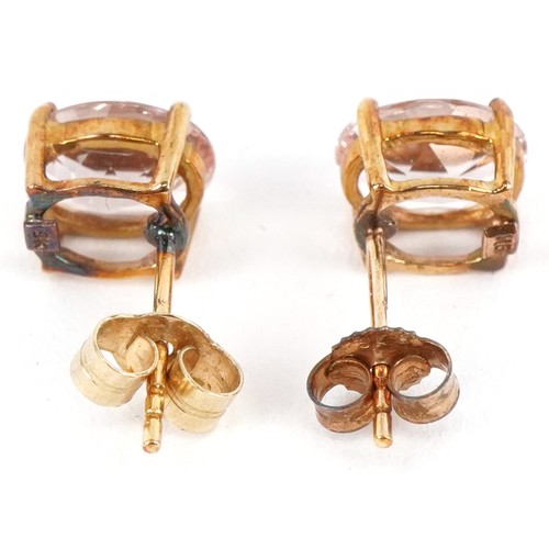 3210 - A pair of 9K pink tourmaline stud earrings, 7.9mm high, total 1.5g.