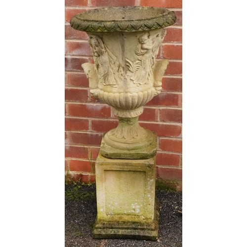 2228 - A cast composition garden urn and pedestal, 92cm.