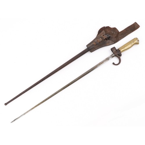 2850 - A French military interest bayonet and scabbard with cross blade, 65cm in length.