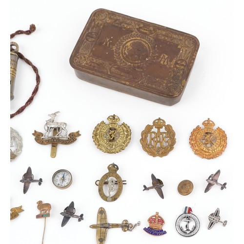 2826 - British militaria including a Christmas 1914 Mary tin, cap badges and a Metropolitan Police whistle.