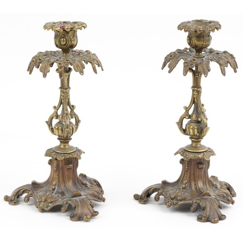 522 - A pair of Victorian ormolu acanthus leaf  candlesticks, on scroll bases, 24cm high.