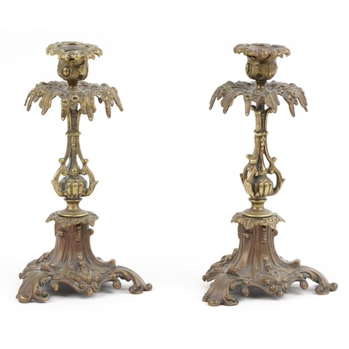 522 - A pair of Victorian ormolu acanthus leaf  candlesticks, on scroll bases, 24cm high.