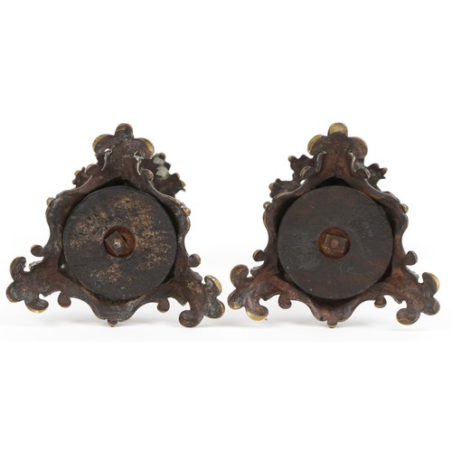 522 - A pair of Victorian ormolu acanthus leaf  candlesticks, on scroll bases, 24cm high.