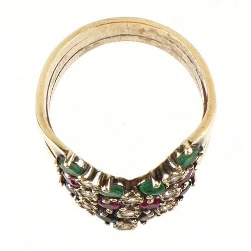 3029 - A 9ct gold multi gem triple wishbone ring set with diamonds, rubies, emeralds and spinel, size Q, 6.... 