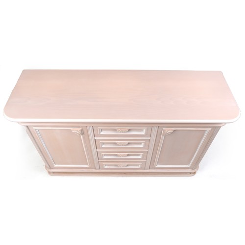 2175 - A modern suite of pink painted dining room furniture comprising a side cabinet, corner cabinet, tabl... 