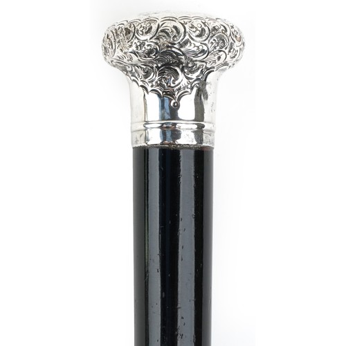 424 - A George V ebonised walking stick with embossed silver handle, J S & Co. maker's mark, Birmingham 19... 