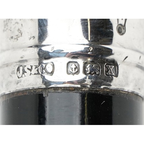 424 - A George V ebonised walking stick with embossed silver handle, J S & Co. maker's mark, Birmingham 19... 