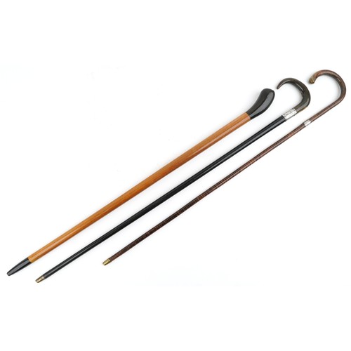 421 - Three early 20th century walking sticks, one with horn handle, including an ebonised example with a ... 