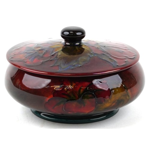179 - A Moorcroft pottery pot and cover hand painted in the Hibiscus pattern, bearing paper label to the b... 