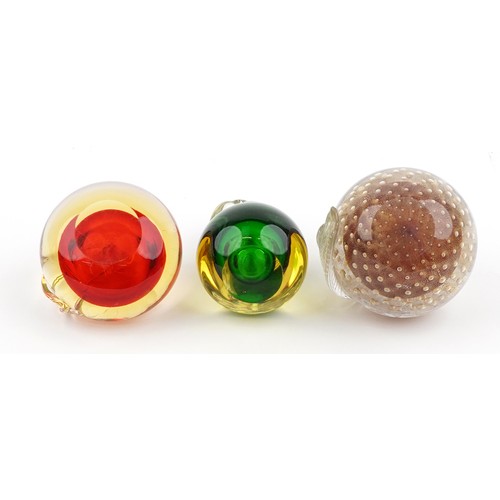 640A - Three Murano glass paperweights in the form of fruit, the largest W-10cm