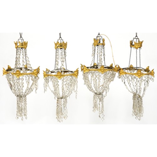 2194 - A set of four early 20th century gilt metal ceiling lights with cut glass drops, 75cm high x 36cm in... 