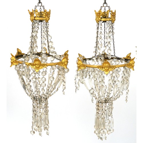 2194 - A set of four early 20th century gilt metal ceiling lights with cut glass drops, 75cm high x 36cm in... 
