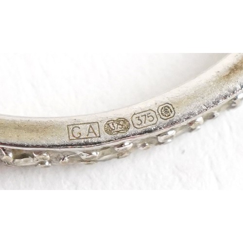 3293 - A 9ct white and yellow gold cubic zirconia and blue spinel ring with a detachable band, size N, 3.4g... 