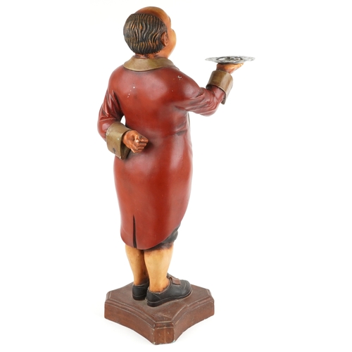  A vintage fibre glass floor standing dumb waiter holding a silver plated tray, 100cm high.