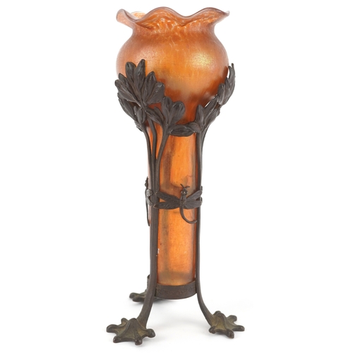  An Art Nouveau bronze and orange iridescent glass vase attributed to Loetz, the hand blown glass bow... 