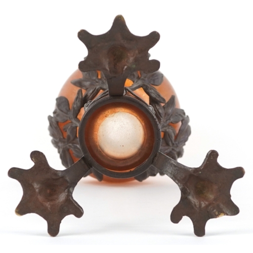  An Art Nouveau bronze and orange iridescent glass vase attributed to Loetz, the hand blown glass bow... 