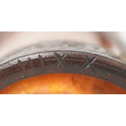  An Art Nouveau bronze and orange iridescent glass vase attributed to Loetz, the hand blown glass bow... 