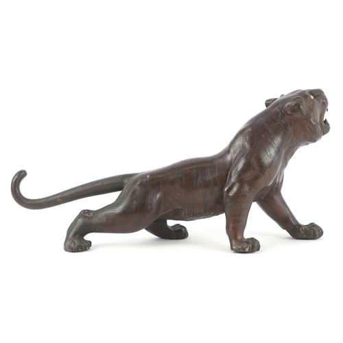  A Japanese bronze okimono figure of a tiger bearing signature to the base, 30cm in length.