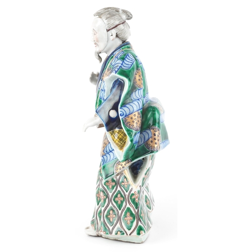  A Japanese Kutani hand painted porcelain figure modelled as a Samurai, 20th century, 30cm high.